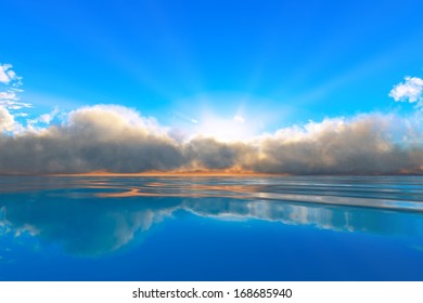 sun rays in clouds over tranquil ocean sunset