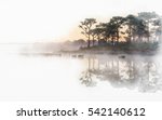 Sunrise  reflected in calm lake waters in watercolor painting  