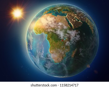 Sunset above Burundi highlighted in red on planet Earth with atmosphere and clouds. 3D illustration. Elements of this image furnished by NASA.