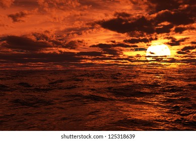 Sunset with clouds at sea