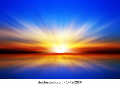 Sunset Over The Sea. Blue Sky. Red Horizon. Yellow Sun Rays