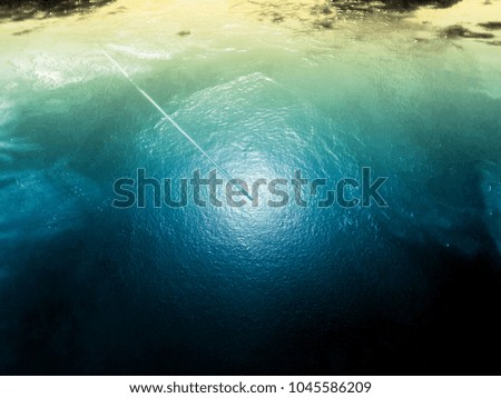 Similar – Aerial view of small boat in sea