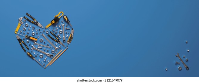 A symbolic heart made of construction tools set. Creative template for the Builder's Day, Labor Day (and similar professional holidays) or the Valentine's Day greeting card or banner. 3D render. - Powered by Shutterstock