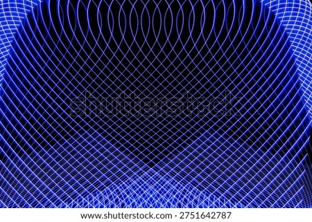 Symmetrical abstract waves with selective focus in blue and green light patterns. Abstract wave symmetry.