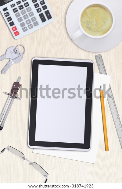 Tablet, keys with
divider on office
table