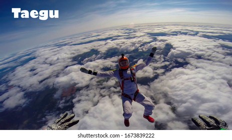 Taegu. Skydiver from Taegu performs a trick in the sky. Free fall. Adrenaline.
