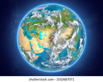 Tajikistan in red on model of planet Earth with clouds and atmosphere in space. 3D illustration. Elements of this image furnished by NASA.