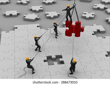 Team building a great jigsaw puzzle. A team building a great jigsaw puzzle project on the ground. - Powered by Shutterstock