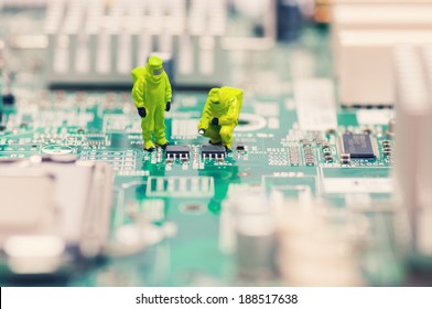 Technicians repairing circuit board - Powered by Shutterstock