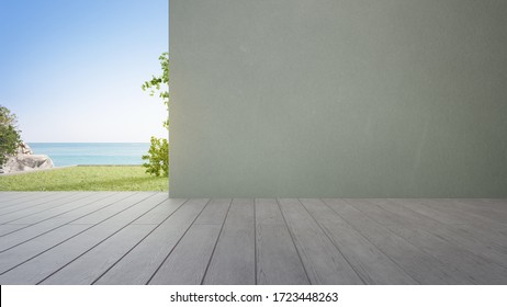 Terrace Near Garden In Modern Beach House Or Luxury Villa. Wooden Deck 3d Rendering With Sea View And Empty Concrete Wall Background.