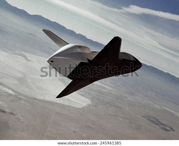 Test\
of the space shuttle prototype Enterprise in a free flight glide\
and landing on Rogers Dry Lake bed. During the test, pilots and\
engineers test the Space Shuttle\'s handling.\
1977.