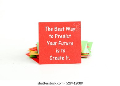text on a red note paper.the best way to predict your future