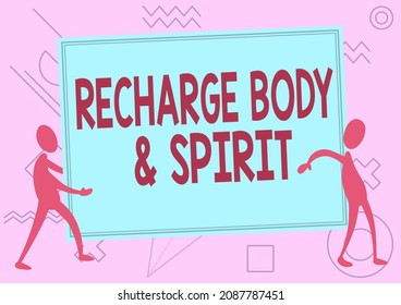 Text Sign Showing Recharge Body And Spirit. Business Idea Fill Your Energy Through Relaxation And Having Fun Two Colleagues Standing Carrying Large Blank Board Showing Unity.