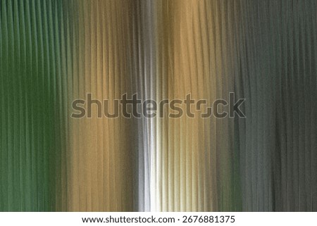 A textured abstract background features vertical lines with a gradient of green, gold, and dark gray hues, creating a sense of depth and movement