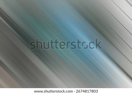 A textured abstract background featuring diagonal motion blur. Shades of grey and a touch of blue create a sophisticated and modern look, suggesting speed and technological advancement.