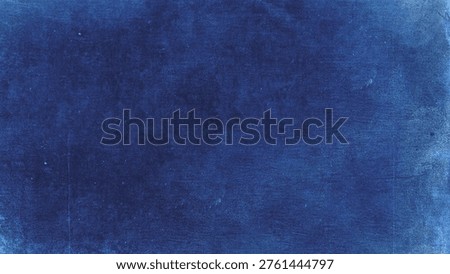A textured, deep blue background with a slightly worn appearance, resembling a painted canvas or fabric. Ideal for design projects or artistic backdrops.