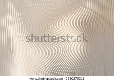 A textured metallic surface with a swirling pattern of embossed lines that create a sense of depth and movement