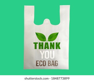 Thank You Bag Design Illustration With Green Leaves Isolated On Green Background.  Copy Space For Text And Logo. Polypropylene Fabric Shopping Bag Alternative Of Plastic.