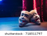 Theater masks, drama and comedy with a red curtain as backdrop / 3D Rendering, Mixed media.