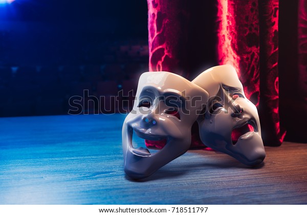Theater masks, drama and comedy\
with a red curtain as backdrop / 3D Rendering, Mixed\
media.