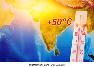 A Thermometer With A Record High Temperature Of Fifty Degrees Celsius, Against The Backdrop Of The Continent Of The Indian Subcontinent. Hot Weather Concept