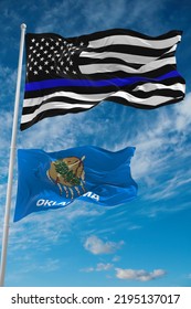 Thin Blue Line Flag Of US With Smaller Flag Of Oklahoma State, Usa At Cloudy Sky Background. United States Of America Police Flag. Copy Space For Vertical Banner. 3d Illustration