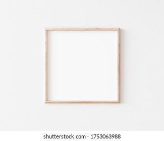 Thin Square Wooden Frame Mockup On White Wall. 3d Illustration.