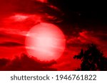 This is an illustration of a tree and the sun with a red color