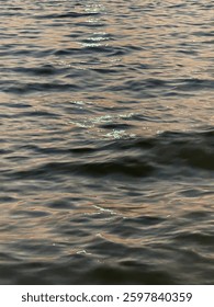 This image captures a close-up view of a body of water with gentle ripples on the surface. 