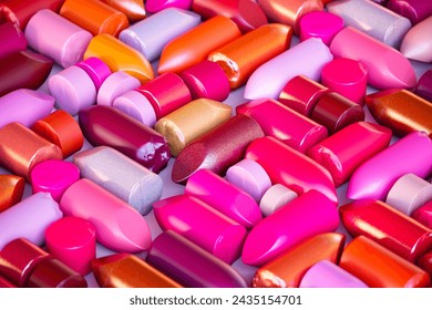 This image captures an exquisite array of lipsticks with an emphasis on the diversity of colors and finishes, from subtle mattes to bold metallics, presented in a close-up composition. - Powered by Shutterstock