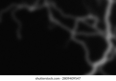 This image captures a monochromatic view of ethereal, wispy cloud formations that seem to blend seamlessly into the background. The soft, gradient shades of gray create a dreamy and somewhat mysterious ambiance, emphasizing the delicate and fluid nature of the clouds. The lack of sharp edges and distinct shapes adds to the abstract and almost surreal quality of the scene, evoking a sense of calm and introspection. The composition focuses on the interplay of light and shadow, highlighting the textures and patterns formed by the clouds against the darker backdrop.