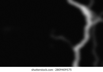 This image captures a striking visual contrast between light and shadow, highlighting an abstract form with smooth curves. The interplay of gradient tones creates a sense of depth and fluidity, emphasizing the interplay between dark and luminous areas. The composition focuses on the interplay of light, casting elongated shadows that enhance the three-dimensional appearance of the subject. The overall effect is both minimalistic and dramatic, evoking a sense of mystery and elegance through its monochromatic palette.