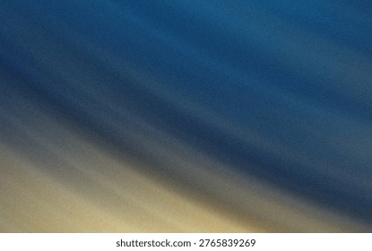 This image captures a tranquil scene of a sandy beach seamlessly blending into the calm blue waters of the ocean. The gradient of colors from light beige sand to deep blue water suggests a peaceful coastal environment, likely during low tide or early morning when the waves are gentle. The subtle texture of the sand contrasts with the smoothness of the water, creating a visually soothing transition.