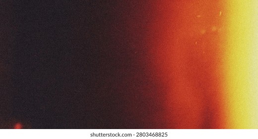This image depicts a gradient background with a blurred transition between warm and cool colors, featuring shades of red, yellow, orange, and black.