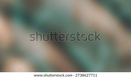 This image features an abstract composition of green and brown hues with a blurred effect. The colors blend together, creating a sense of depth and movement. The overall atmosphere is warm and earthy, with a focus on natural tones.