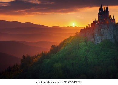 this image features a castle similar to a stronghold, in the background there is an endless expanse of hills and a beautiful sunrise.
