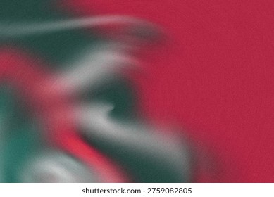 This image showcases a vibrant abstract composition featuring red and green hues with blurry shapes and lighting effects, creating a dynamic and energetic visual experience.