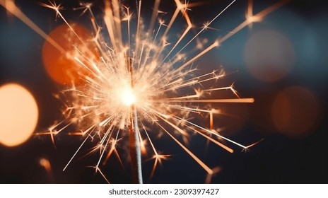 This image shows a close-up of a dark sparkler. The sparkler is held in the hand of an unknown person, and it emits bright sparks that light up the night sky. 