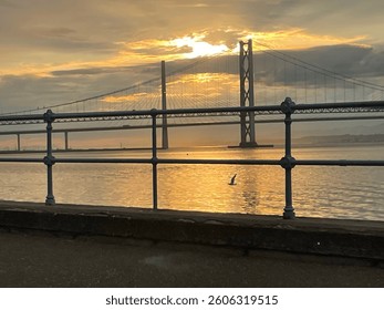 This one was a late night stroll along the firth forth Scotland with the two road bridges crossing one old one new, with a bird flying across the top of the water this is from south Queensferry dusk. 