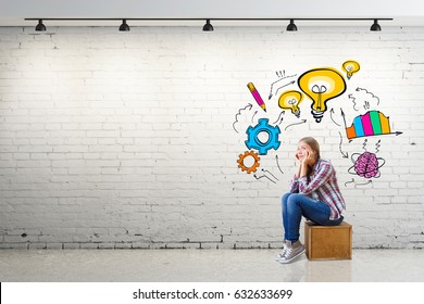 Thoughtful young european woman sitting on wooden box in white brick interior with business sketch on wall. Research concept. 3D Rendering - Powered by Shutterstock