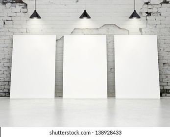 Three Blank Posters On Old Brick Wall