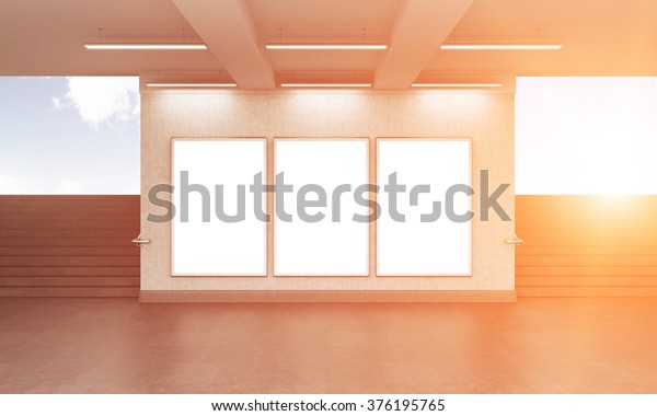 Three blank vertical billboard in the\
underground crossing, stairs up on both sides, blue sky seen from\
the street. Grey walls. Front view. Filter. Concept of underground\
advertising. 3D\
rendering