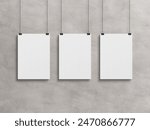 Three Blank vertical poster hanging with clips on a concrete wall Mockup. 3D rendrering