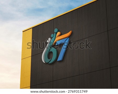 Three dimensional number sixty seven logo mounted on a textured building wall surface