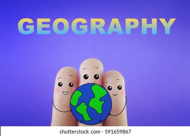 Three fingers decorated as three person holding an earth. Suitable to be used for anything about earth.  - Powered by Shutterstock