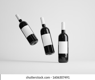 Three Red Wine Bottles Mockup Over White Background. 3D Render