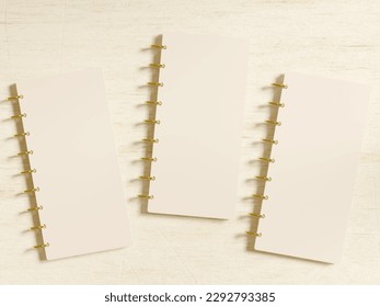 Three small discbound planner covers mockup with blank space for design presentation. Top view flatlay on a desktop. Realistic 3D render.