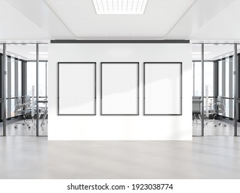 Three vertical frames Mockup hanging on office wall. Mock up of billboards in modern concrete company interior 3D rendering