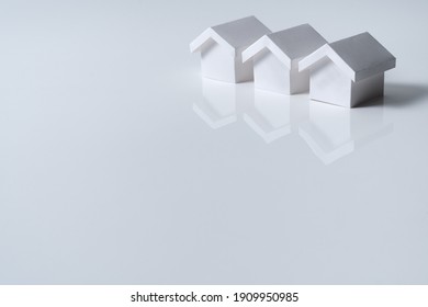 Three White Houses Model In A Row For Real Estate Property, Housing Development Or Community