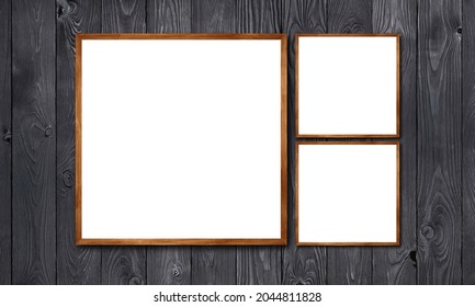 Three Wooden Borders Frames Hanging In Vintage Black Wood Wall. One Big Square Frame And Two Small Squares Foto Frame Design. Picture Frame Collection. 3D Visualization Realistic Photo Blank	
